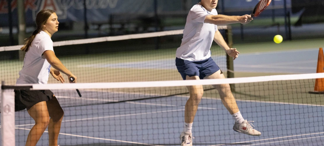 Two players working together on the court 